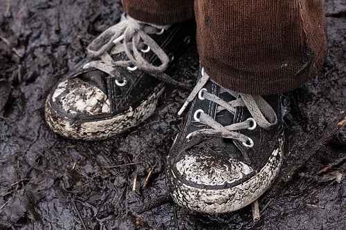 Muddy black converse sneakers